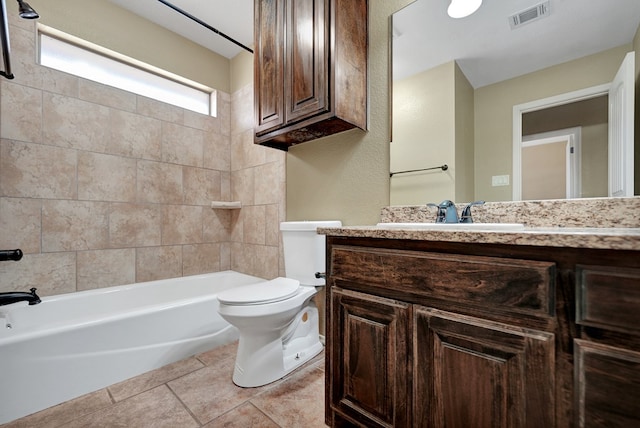 bathroom with visible vents, toilet, vanity, and tile patterned flooring