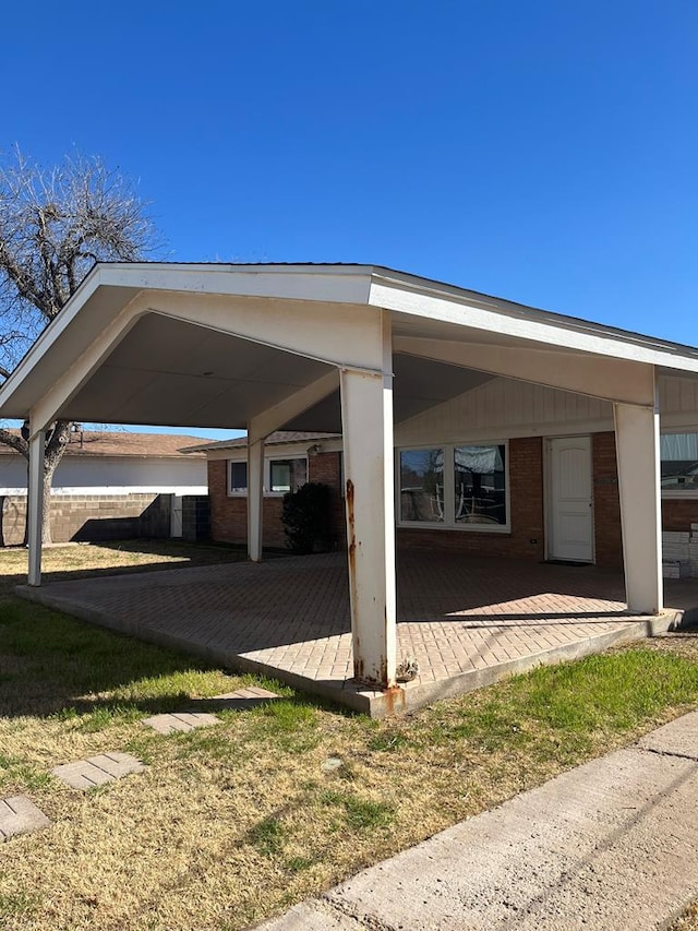 view of car parking featuring a carport