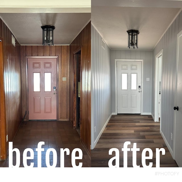 entryway featuring ornamental molding, dark hardwood / wood-style flooring, and a chandelier