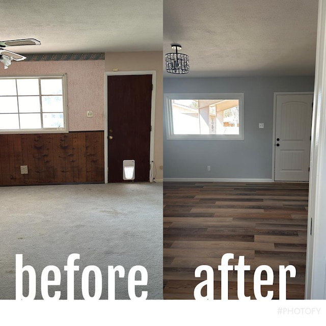 entrance foyer featuring a textured ceiling and wood walls