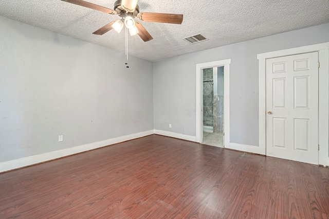 3608 S County Rd 1195, Midland, TX 79706 - spare room featuring wood finished floors, a ceiling fan, baseboards, and a textured ceiling