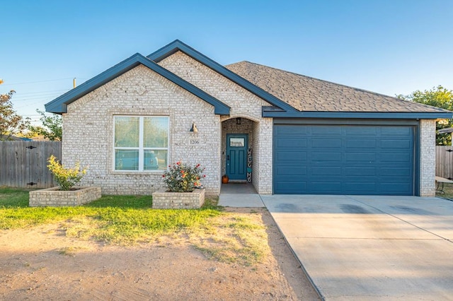 view of front of property with a garage