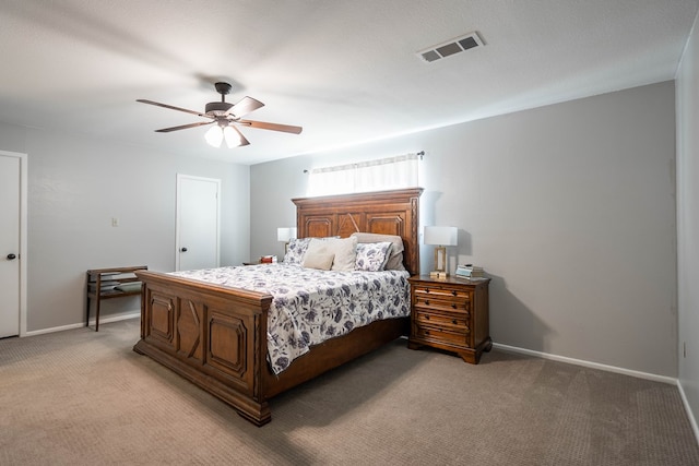 bedroom featuring baseboards, light carpet, a ceiling fan, and visible vents