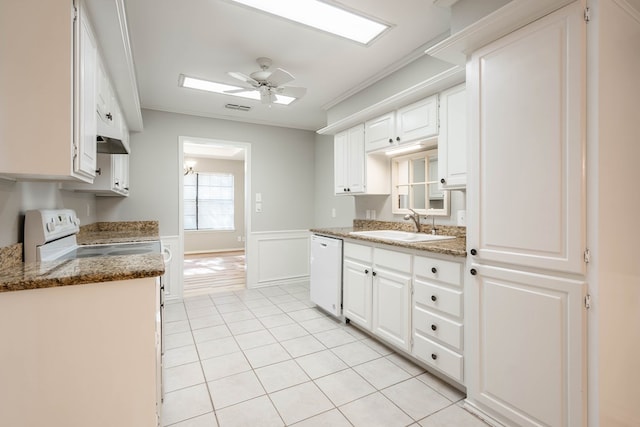 kitchen featuring white cabinets, light tile patterned flooring, a sink, ceiling fan, and white appliances