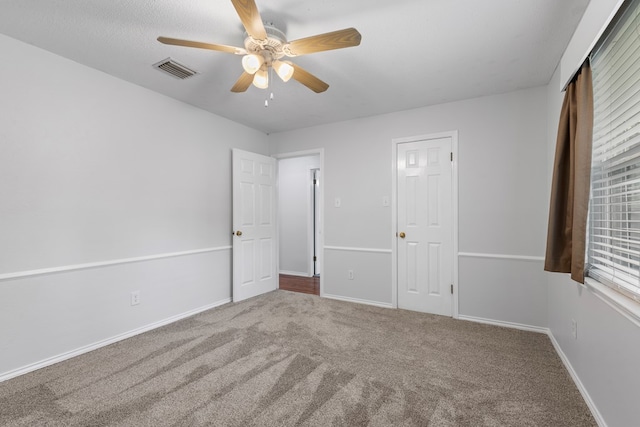 unfurnished bedroom with carpet flooring and ceiling fan