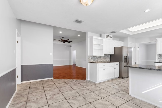 kitchen featuring white cabinetry, light tile patterned floors, ceiling fan, and stainless steel refrigerator with ice dispenser