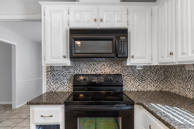 kitchen with black appliances, white cabinetry, backsplash, and dark stone counters