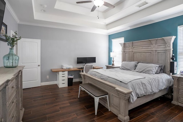 bedroom featuring a raised ceiling, visible vents, wood tiled floor, ceiling fan, and baseboards