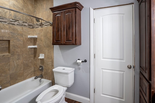 full bathroom featuring baseboards, toilet, and shower / bathtub combination