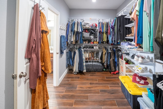 spacious closet with wood tiled floor