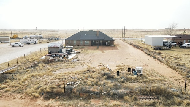 view of yard with a rural view and fence