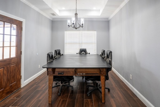 dining area with visible vents, baseboards, ornamental molding, wood tiled floor, and a raised ceiling