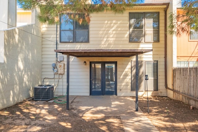 back of house with central AC unit and a patio area