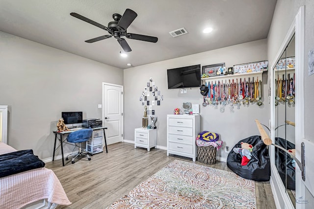 6811 W County Rd 41, Midland, TX 79707 - bedroom with an office area, wood finished floors, baseboards, a ceiling fan, and recessed lighting