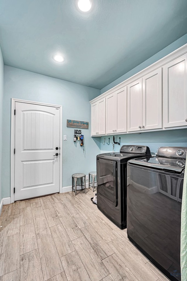 6811 W County Rd 41, Midland, TX 79707 - laundry room featuring washer and dryer, cabinet space, baseboards, light wood-style flooring, and recessed lighting