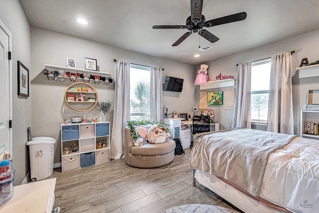 6811 W County Rd 41, Midland, TX 79707 - bedroom featuring multiple windows, light wood-style floors, recessed lighting, and a ceiling fan