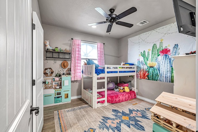 6811 W County Rd 41, Midland, TX 79707 - bedroom featuring wood finished floors, baseboards, and a ceiling fan