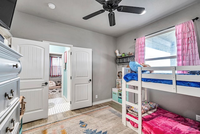 6811 W County Rd 41, Midland, TX 79707 - bedroom featuring wood finished floors, baseboards, and a ceiling fan