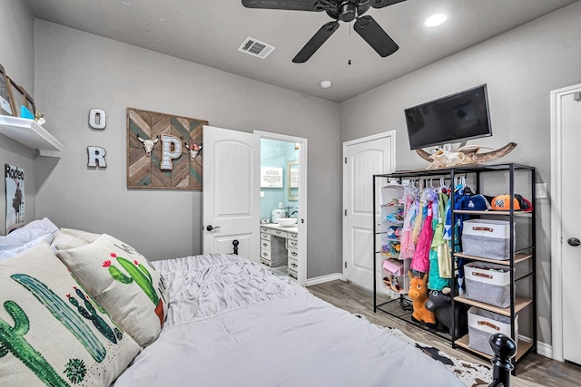 6811 W County Rd 41, Midland, TX 79707 - bedroom with wood finished floors, baseboards, recessed lighting, ensuite bathroom, and a ceiling fan