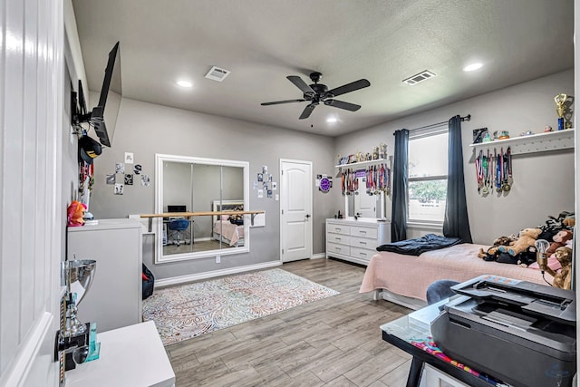 6811 W County Rd 41, Midland, TX 79707 - bedroom with wood finished floors, recessed lighting, ceiling fan, and baseboards