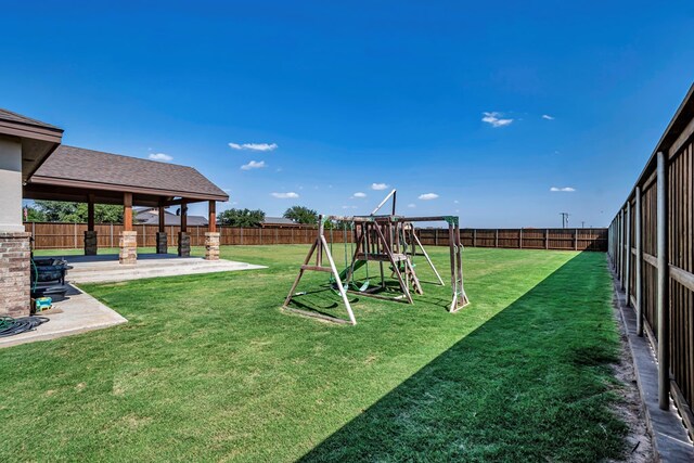 6811 W County Rd 41, Midland, TX 79707 - view of yard with a patio area and a playground