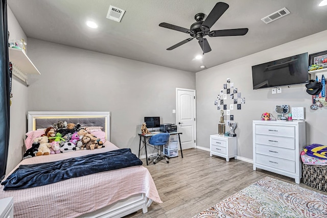 6811 W County Rd 41, Midland, TX 79707 - bedroom with wood finished floors, recessed lighting, ceiling fan, baseboards, and a desk