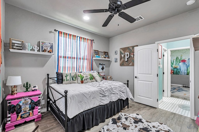 6811 W County Rd 41, Midland, TX 79707 - bedroom with wood finished floors and ceiling fan