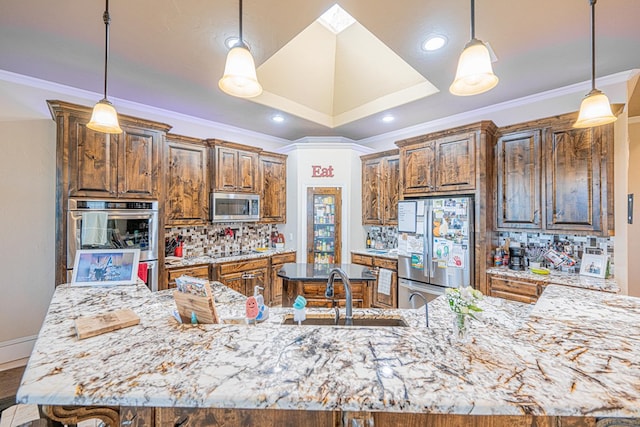 kitchen featuring stainless steel appliances, a sink, decorative backsplash, and light stone countertops