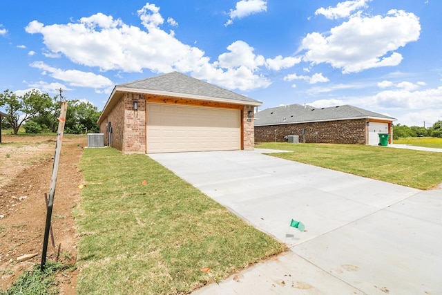 804 Bella Bvd, Coleman, TX 76834 - ranch-style house with brick siding, a garage, a front lawn, driveway, and roof with shingles