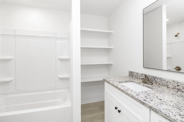 804 Bella Bvd, Coleman, TX 76834 - bathroom with vanity and wood finished floors