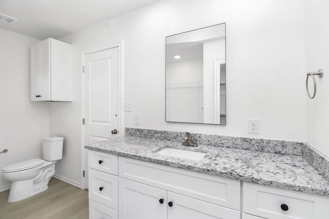 804 Bella Bvd, Coleman, TX 76834 - bathroom featuring vanity and wood finished floors