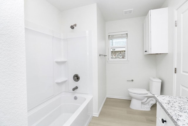 804 Bella Bvd, Coleman, TX 76834 - full bath with vanity, wood finished floors, and shower / washtub combination