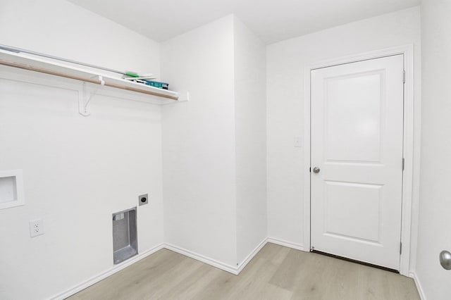 804 Bella Bvd, Coleman, TX 76834 - washroom with electric dryer hookup, light wood-style flooring, and hookup for a washing machine