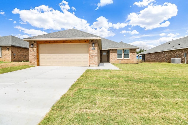 804 Bella Bvd, Coleman, TX 76834 - single story home featuring brick siding, driveway, an attached garage, and a front lawn