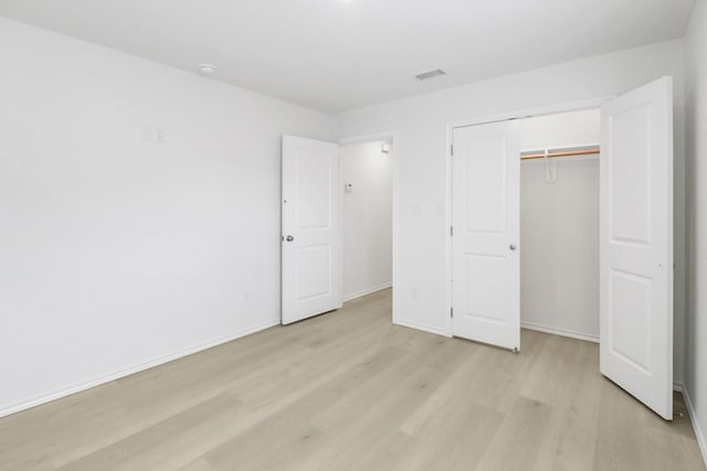804 Bella Bvd, Coleman, TX 76834 - unfurnished bedroom featuring light wood-style floors and a closet