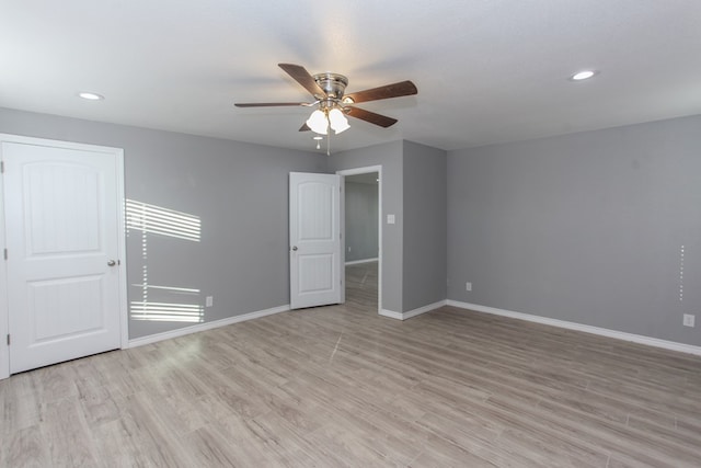 unfurnished room with light wood-style floors, recessed lighting, baseboards, and a ceiling fan