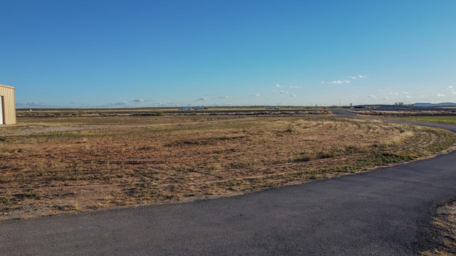 view of yard with a rural view