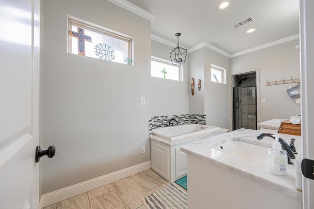 full bath featuring a garden tub, a sink, visible vents, a stall shower, and crown molding