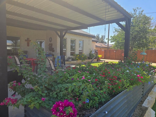 exterior space featuring a patio and fence