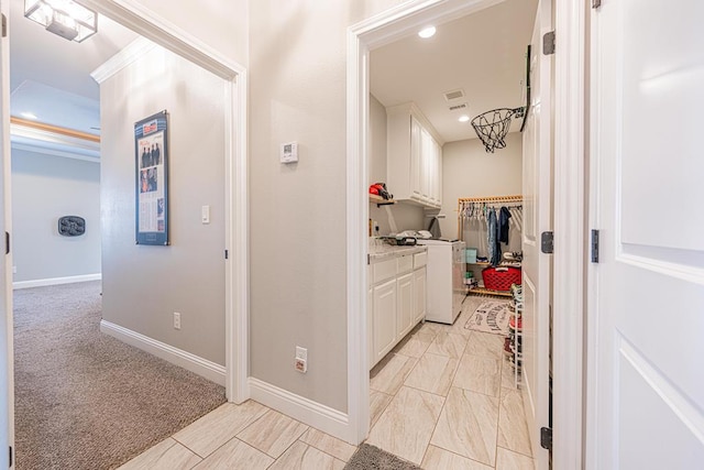 corridor with recessed lighting and baseboards