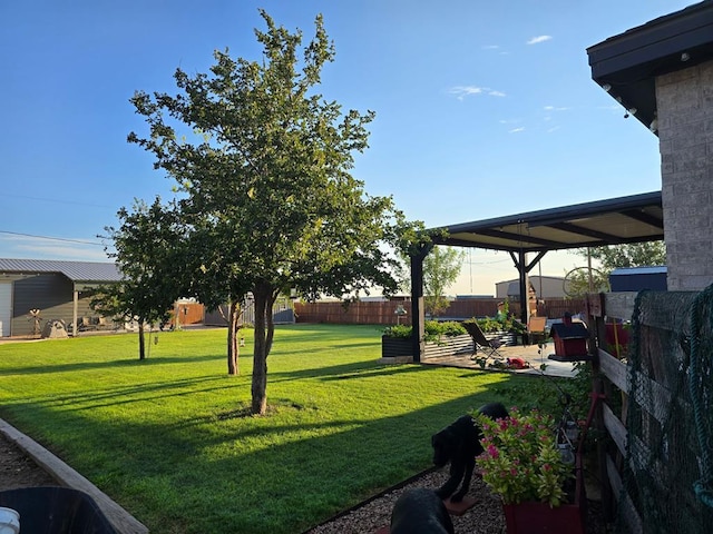 view of yard with fence and a patio