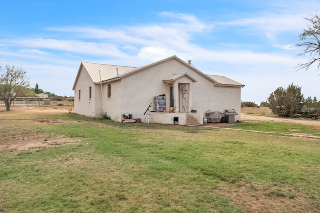 back of house with brick siding