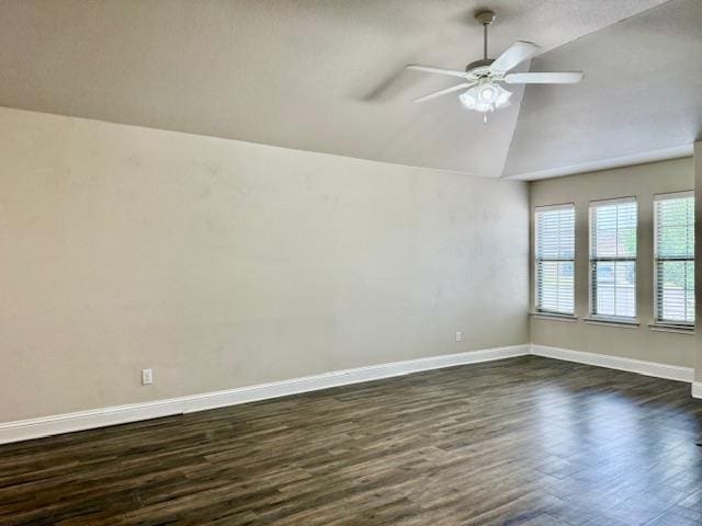 606 Memorial Ct, Midland, TX 79706 - unfurnished room with dark wood-style floors, vaulted ceiling, ceiling fan, and baseboards