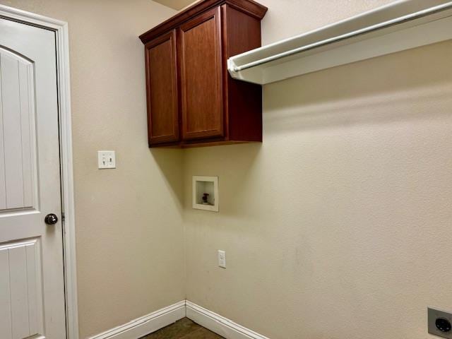 606 Memorial Ct, Midland, TX 79706 - laundry room featuring hookup for an electric dryer, cabinet space, hookup for a washing machine, and baseboards