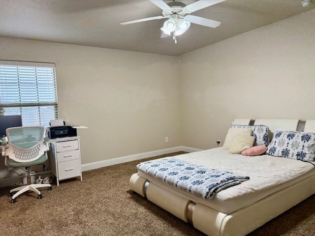 carpeted bedroom featuring baseboards and ceiling fan