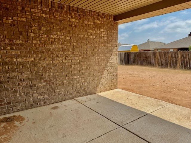 606 Memorial Ct, Midland, TX 79706 - fenced backyard with a patio