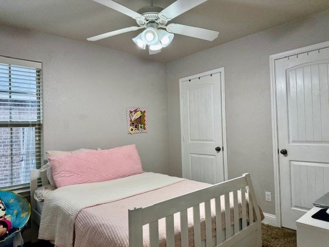 bedroom with carpet floors, ceiling fan, and baseboards