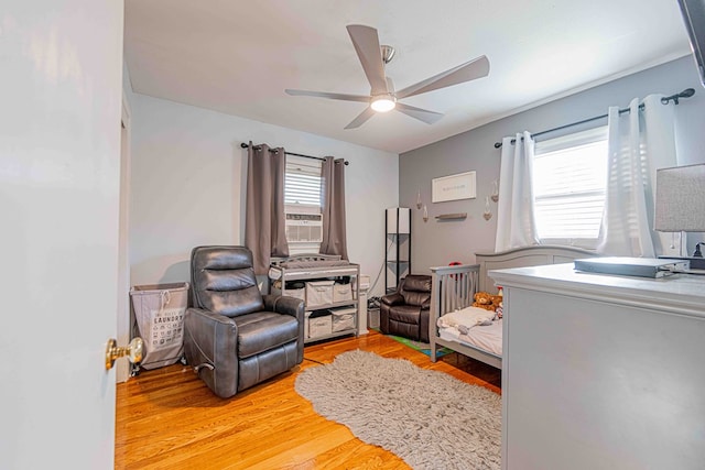 bedroom featuring ceiling fan and light wood-type flooring