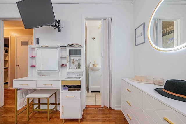 kitchen with hardwood / wood-style floors and sink