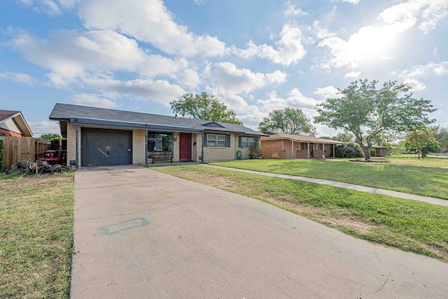 ranch-style home with a garage and a front lawn